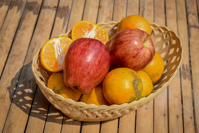 High angle view of fruits in basket on table