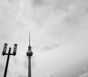 Low angle view of communications tower against sky