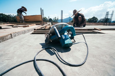 Workers working on building at construction site