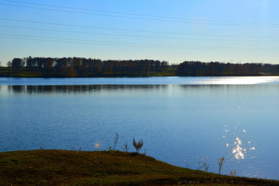 Scenic view of lake against sky during winter