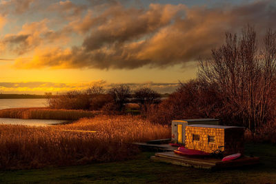 Scenic view of field against sky during sunset