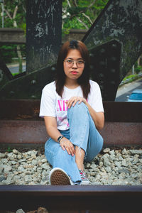 Portrait of woman sitting outdoors