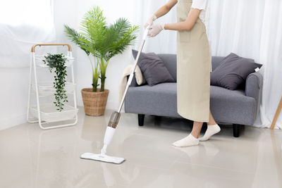 Low section of woman exercising on table