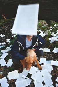 High angle view of man holding paper