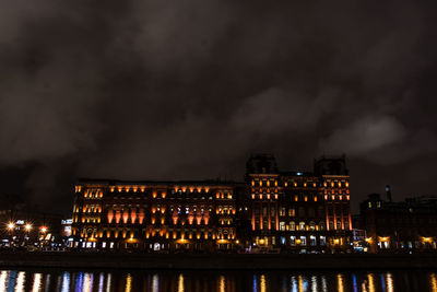 Illuminated buildings in city at night