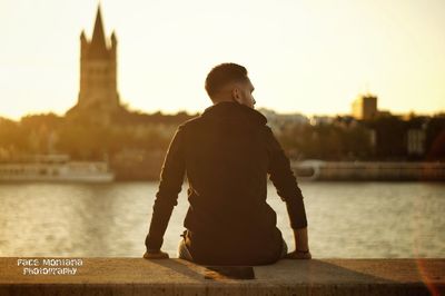 Rear view of man looking at city