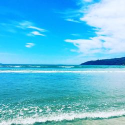 Scenic view of sea against blue sky