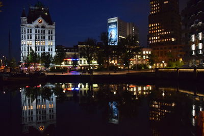 Reflection of illuminated buildings in water at night