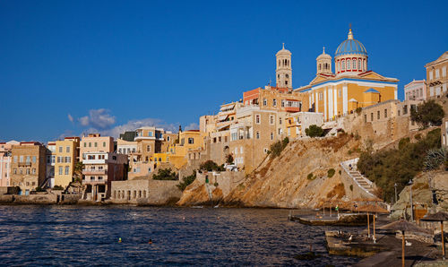 Asteria beach and agios nikolaos church in ermoupoli, syros