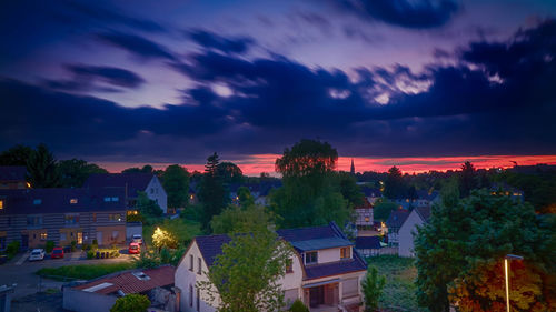 Panoramic view of cityscape against sky at sunset