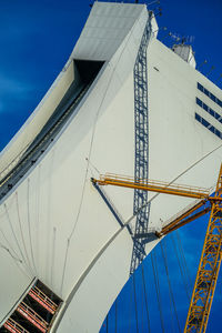 Low angle view of built structure against blue sky