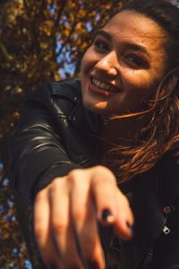 Portrait of young woman with hands