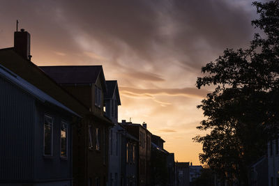 Low angle view of building against sky during sunset
