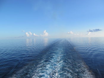 Scenic view of sea against blue sky