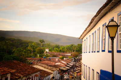 Buildings in town against sky