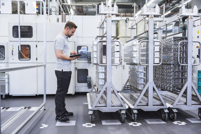 Man using tablet in factory shop floor