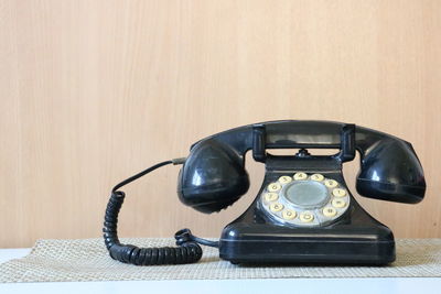 Close-up of telephone on table