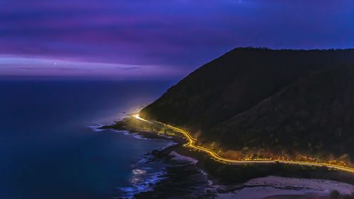High angle view of light trails on great ocean road at night