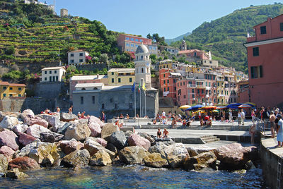 People in front of sea