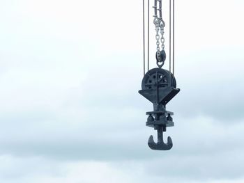 Close-up of chain against sky