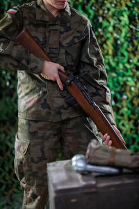 A lady soldier inspects a newly received self-reloading rifle.