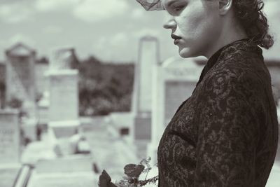 Woman standing in cemetery