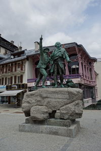 Statue of building against sky