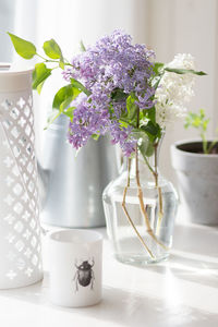 Close-up of white flower vase on table