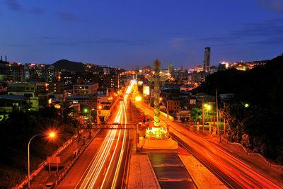 High angle view of light trails on road at night