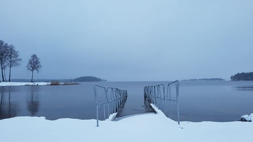 Scenic view of frozen lake against clear sky