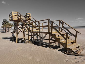 Lifeguard hut on beach against clear sky