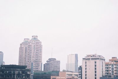 Low angle view of buildings against clear sky