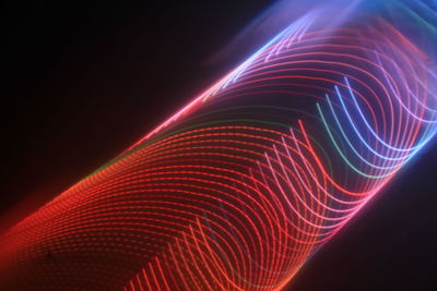 Close-up of light trails against black background