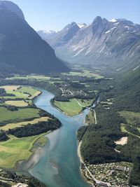 Aerial view of lake and mountains against sky