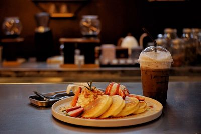 Close-up of food and drink on table in restaurant