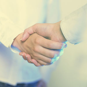 Close-up of couple holding hands