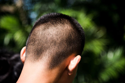 Close-up rear view of man outdoors