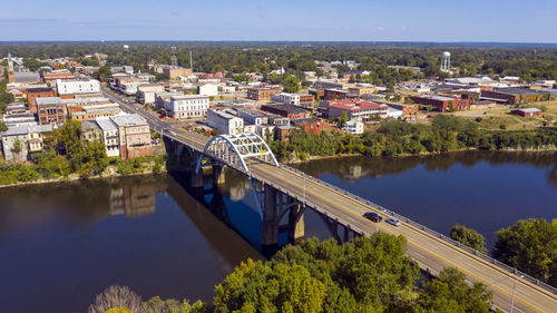 High angle view of river and buildings against sky