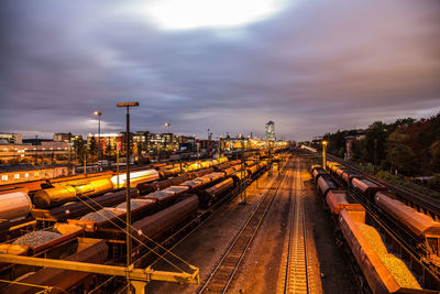 High angle view of train at railroad station against sky