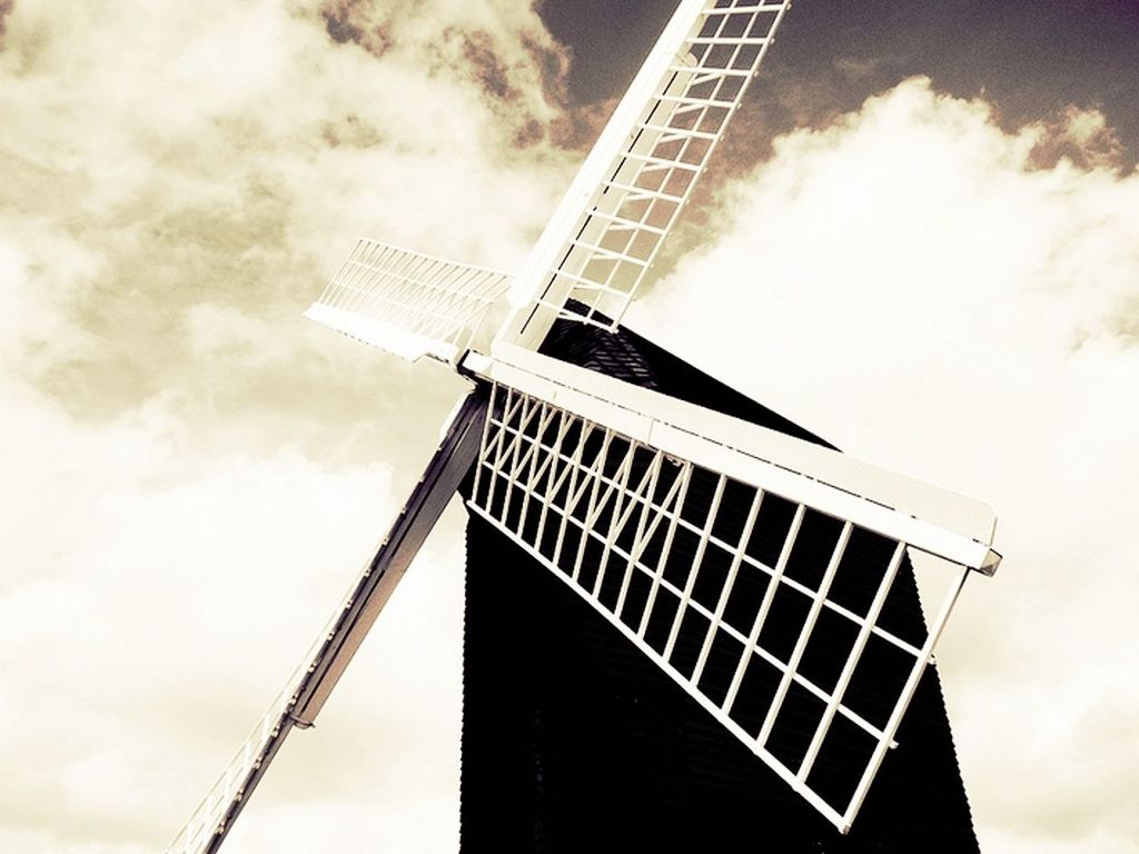 low angle view, tall - high, sky, built structure, architecture, building exterior, tower, cloud - sky, cloudy, construction site, development, crane - construction machinery, skyscraper, tall, cloud, alternative energy, communication, modern, outdoors, renewable energy