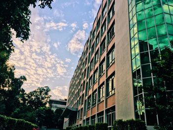 Low angle view of office building against sky