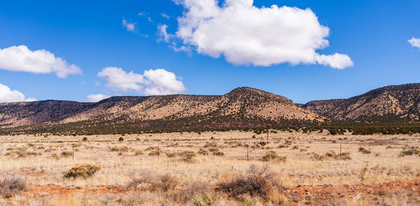 Scenic view of landscape and mountains against sky