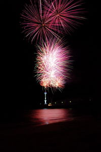 Firework display at night