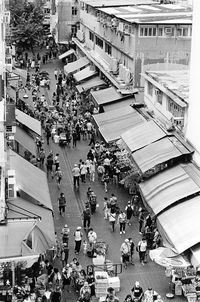 High angle view of people walking on street in city