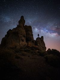 Low angle view of rock formation against sky