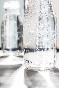 Close-up of drinking water in bottle on table