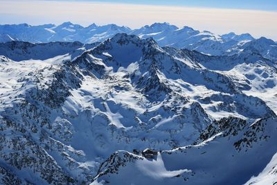 Scenic view of snow mountains against sky