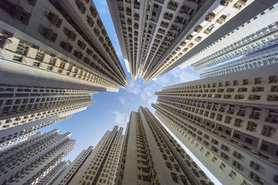 Low angle view of buildings against sky in city