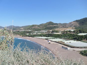 Scenic view of mountains against clear blue sky