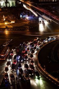 High angle view of illuminated road in city at night